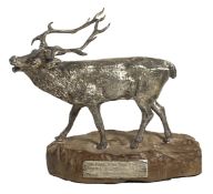 A silver figure of a stag, hallmarked, Edinburgh, Hamilton & Inches, circa 1958, on wooden base,