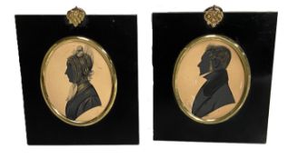 A group of five Victorian silhouettes, mid to late 19th century; together with a pair of portrait