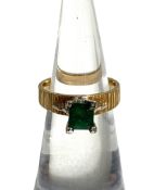 An Emerald and 18 carat gold solitaire engagement ring, late 20th century, the emerald cut central