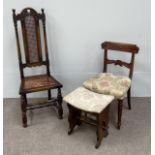 An oak Jacobean style hall chair, with caned seat; together with a Regency mahogany dining chair and
