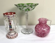 A Victorian flashed white cranberry glass table lustre, with rose decorations and clear glass drops;