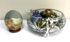 A glass bowl, containing a group of assorted novelty eggs, and other decorative glass items,