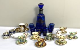 A selection of novelty miniature tea cups and saucers, also an attractive blue glass liqueur set (