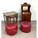 A pair of red ‘leathered’ footstools; together with a beech nest of tables and a late Victorian