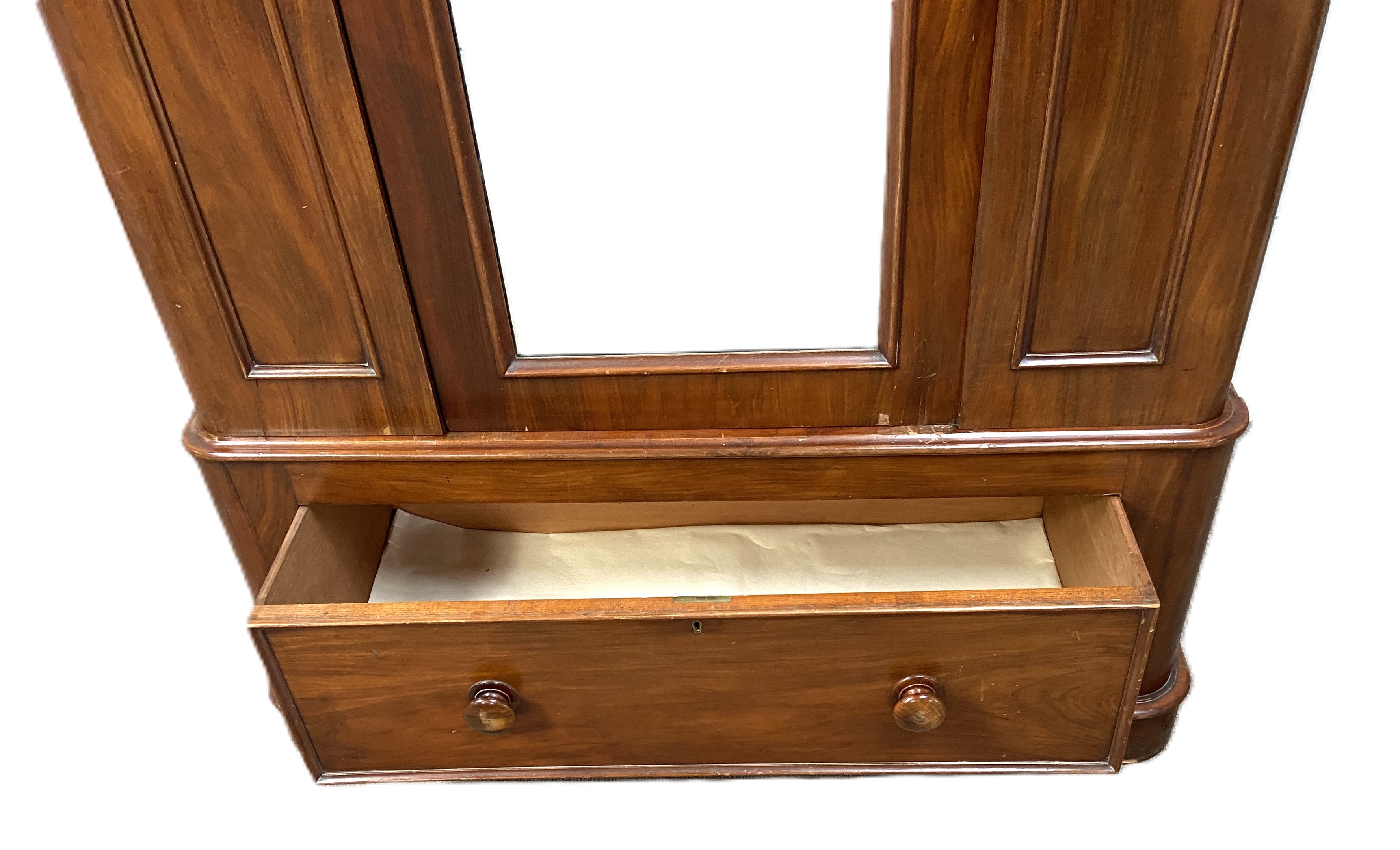 A Victorian mahogany single warbrobe, with mirrored arched door over a long drawer. (lacks - Image 5 of 6