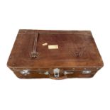 A vintage brown leather suitcase