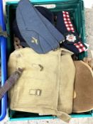 A selection of Military uniform, including assorted Regimental bonnets, a camouflaged helmet, Sam