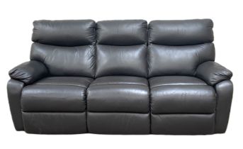 A modern three seat black leather reclining sofa, with two adjustable foot rests