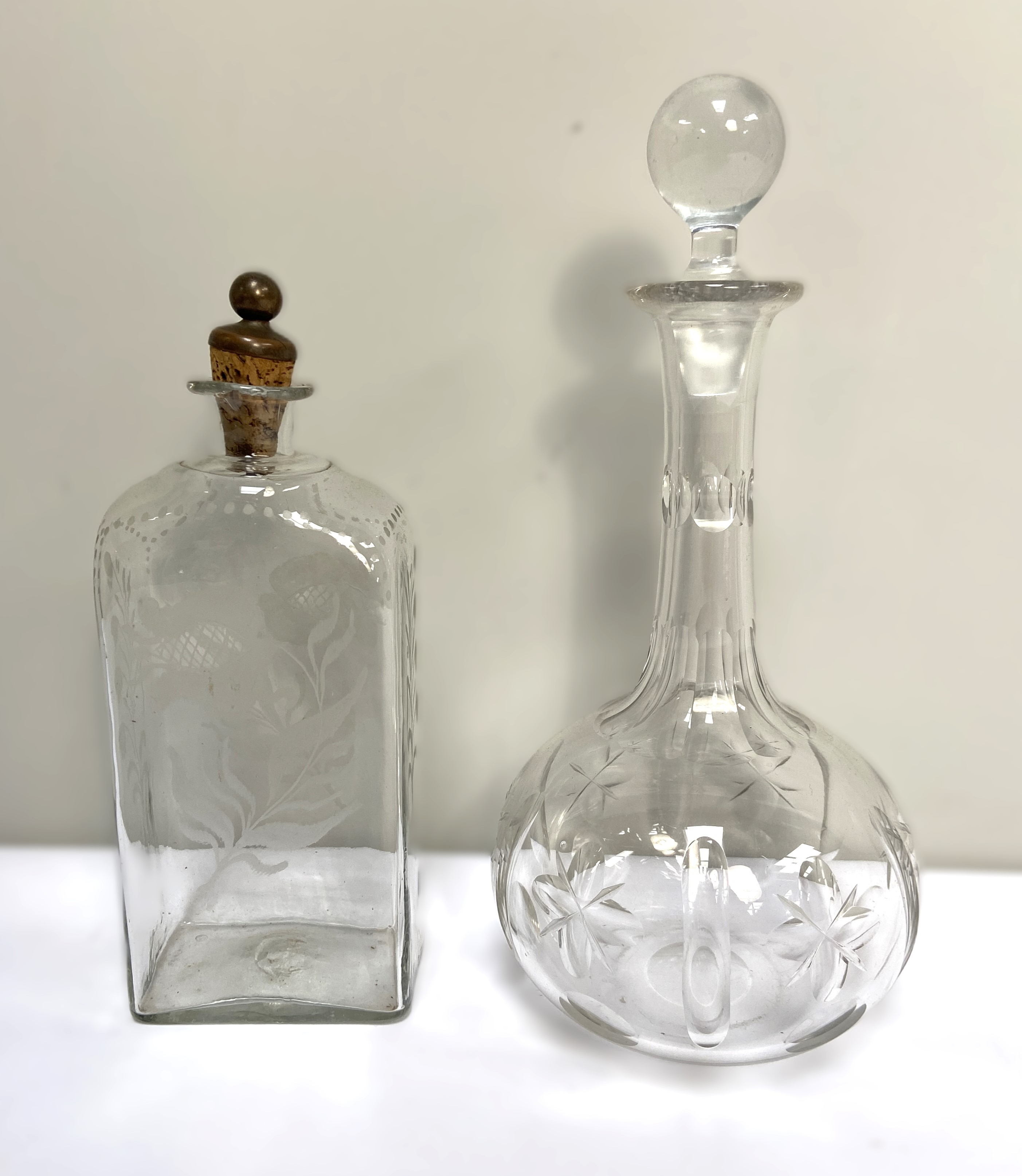 A large assortment of glassware, including a claret decanter, assorted tumblers and wine glasses,