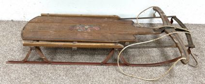 A vintage ‘Flexible Flyer’ sledge, mid 20th century, with rope and hinged yoke