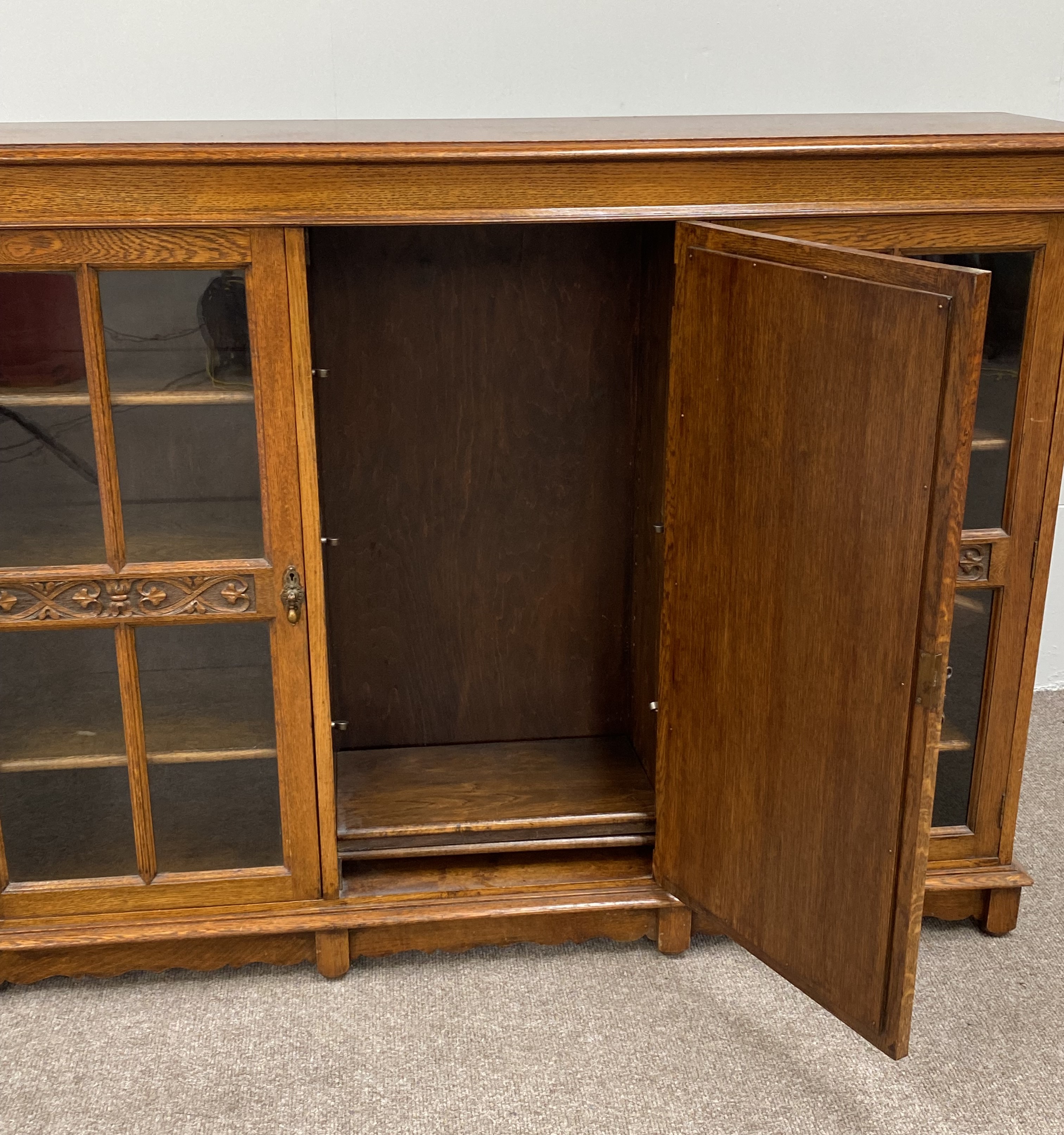 A vintage oak china cabinet, with a central arch moulded door and flanked by two glazed doors, - Image 5 of 8