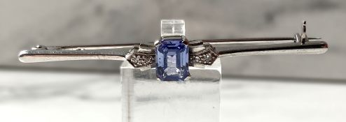 An attractive light pale blue sapphire, diamond and platinum bar brooch, hallmarked 9 carat, with