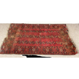 Three assorted decorative rugs, including a small Iranian prayer rug; a small Tekke rug and