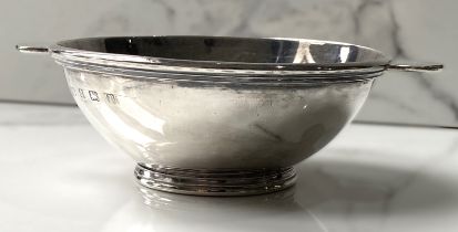 A silver quaich, hallmarked Birmingham 1916, of traditional form, with a wide circular bowl and