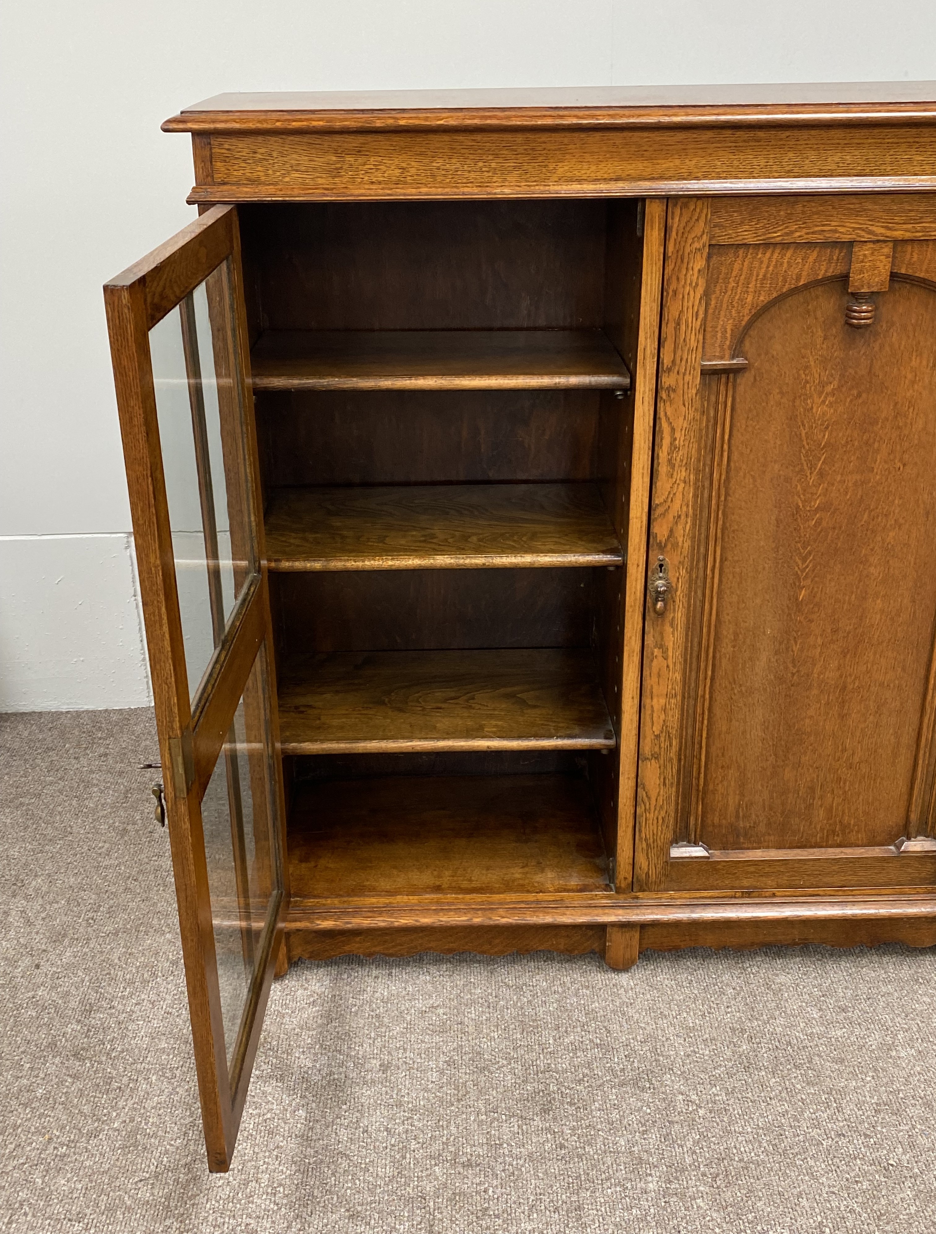 A vintage oak china cabinet, with a central arch moulded door and flanked by two glazed doors, - Image 4 of 8