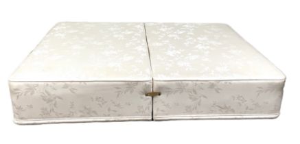 A modern double divan bed base, dividable for transport, with padded top