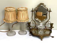 A 19th century gilt metal dressing table mirror; together with a moulded glass table candlestick