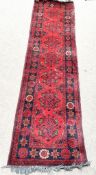 Two vintage rugs, including a Turkish wool Ushak style runner and another similar, both decorated