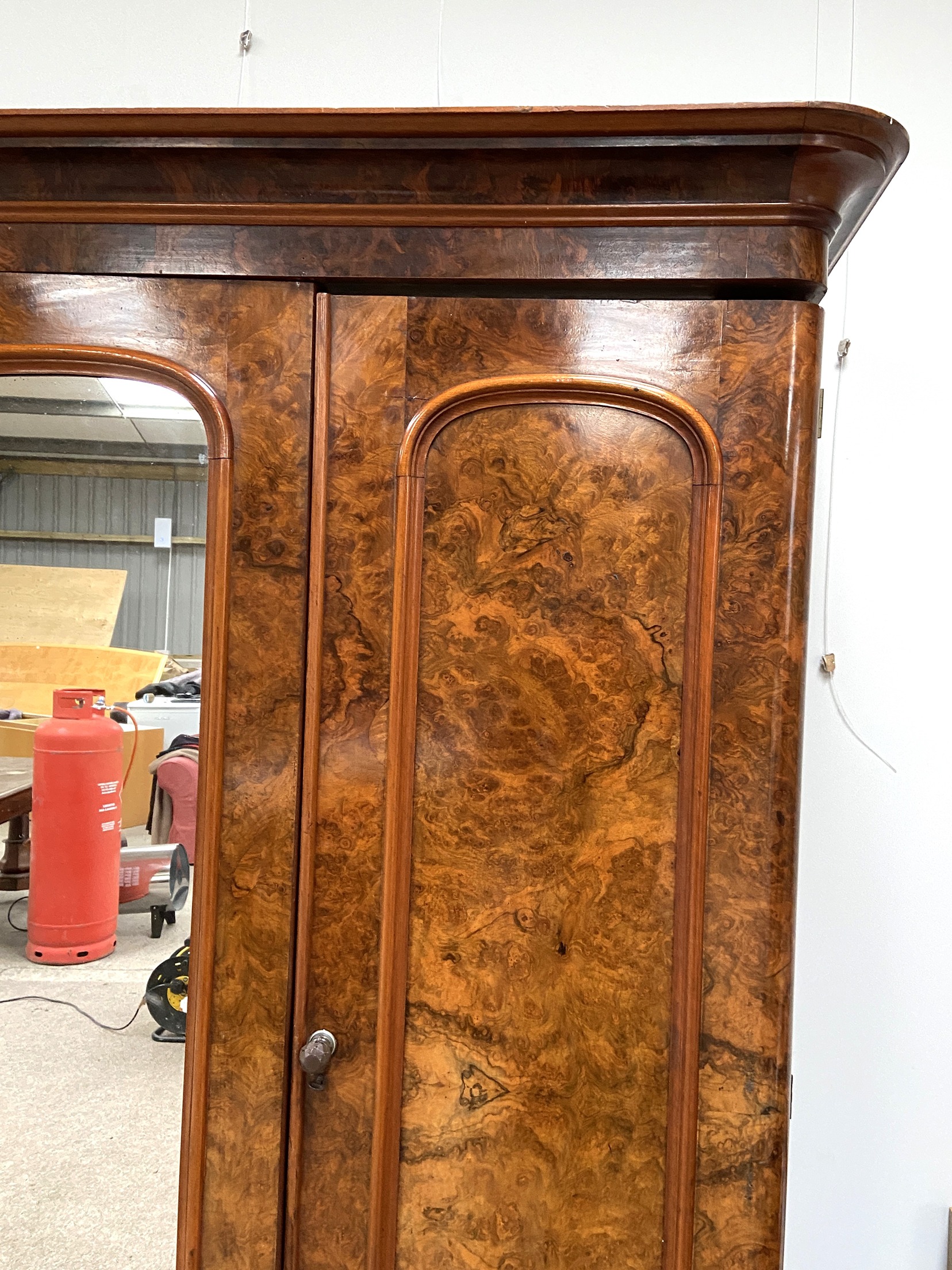 A mid Victorian burr walnut veneered triple wardrobe, circa 1870, with a central arch moulded - Image 4 of 6