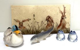 A Contemporary decorated tile, with Hare’s in a meadow; also a novelty Duck condiment dish; a pair