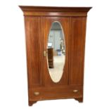 An Edwardian mahogany single wardrobe, with mirrored door and boxwood stringing, 202cm high, 132cm
