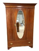An Edwardian mahogany single wardrobe, with mirrored door and boxwood stringing, 202cm high, 132cm