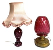 A large late Victorian cranberry glass oil lamp, with a massive ‘honeycomb’ ovoid cranberry shade