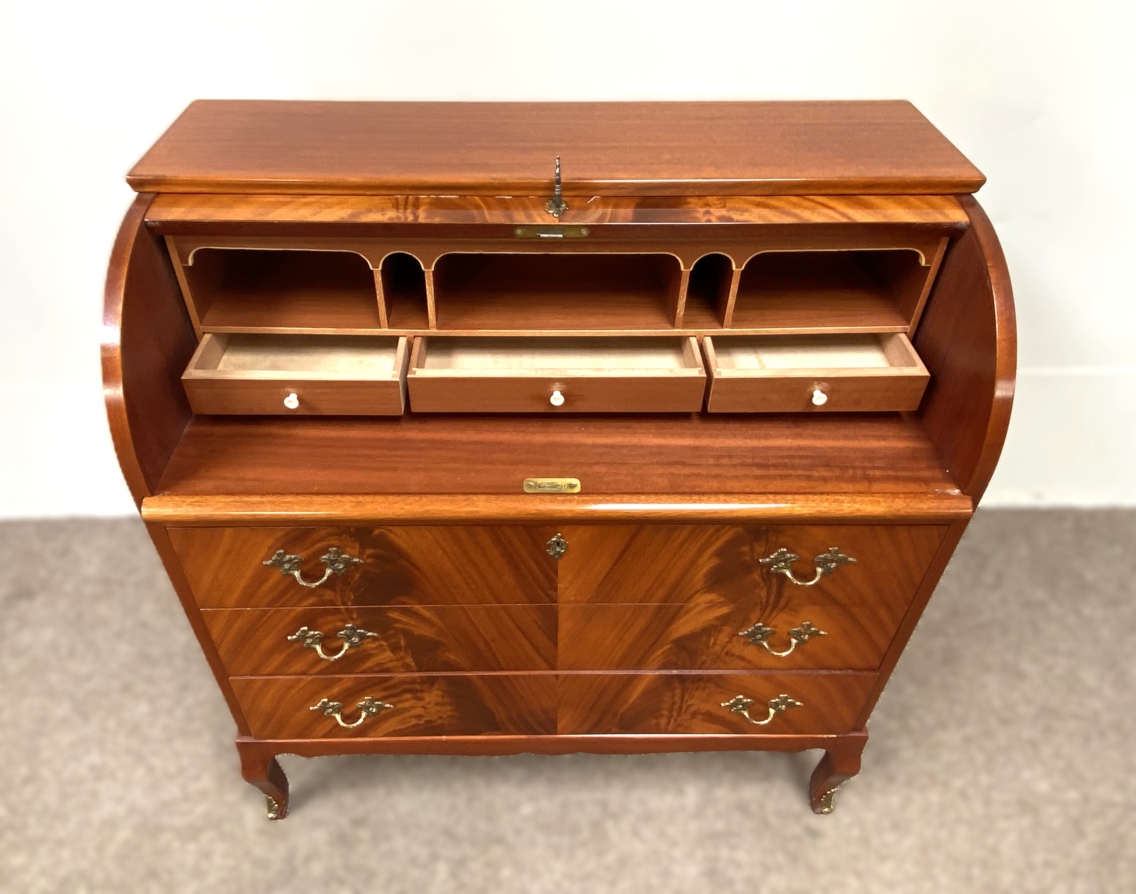 A modern reproduction mahogany veneered cylinder bureau, with roll top and arrangement of niches and - Image 4 of 5