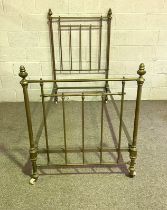 A late Victorian single brass bed frame, with turned finial and iron supports, 90cm wide, 188cm long
