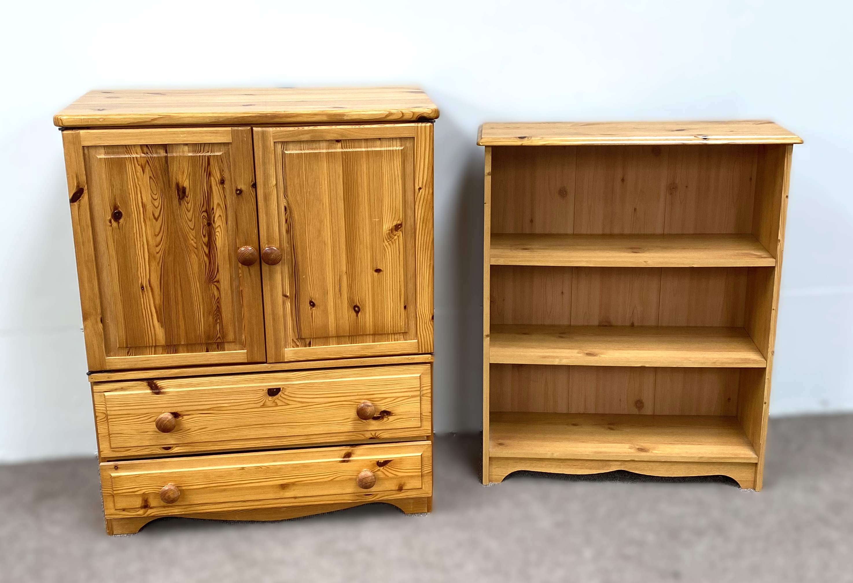 A modern pine cabinet, 98cm high, 80cm wide; also a small pine open bookcase, 88cm high, 74cm