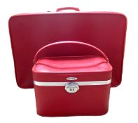 A vintage three piece luggage suite, with two matched cases and a travelling vanity case, in