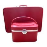 A vintage three piece luggage suite, with two matched cases and a travelling vanity case, in