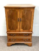 A modern yew veneered tv cabinet, with two cabinet doors, over two drawers