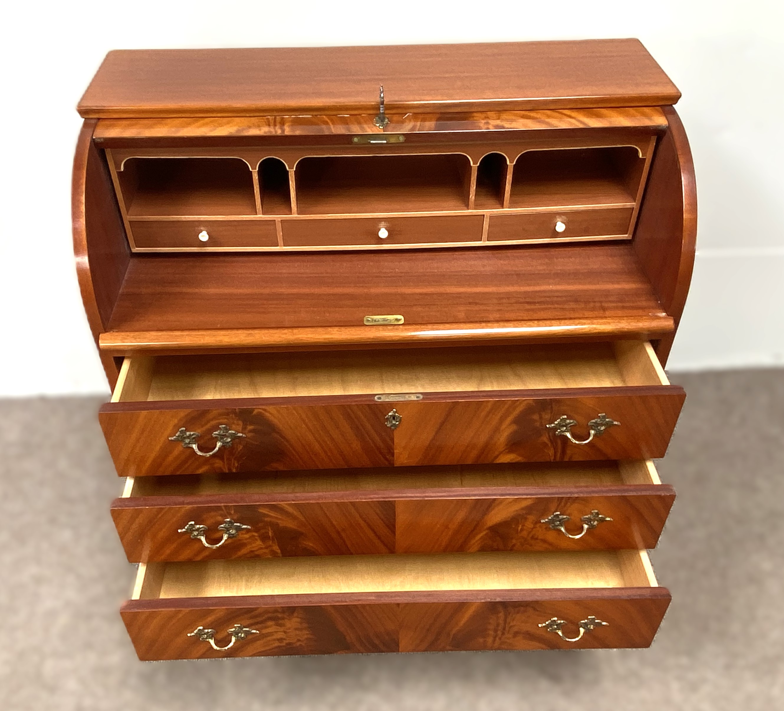 A modern reproduction mahogany veneered cylinder bureau, with roll top and arrangement of niches and - Image 5 of 5