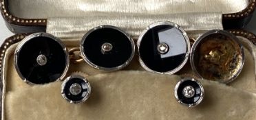 A pair of Gentleman’s 18 carat gold and platinum cuff links, each with diamond centre stud, also a