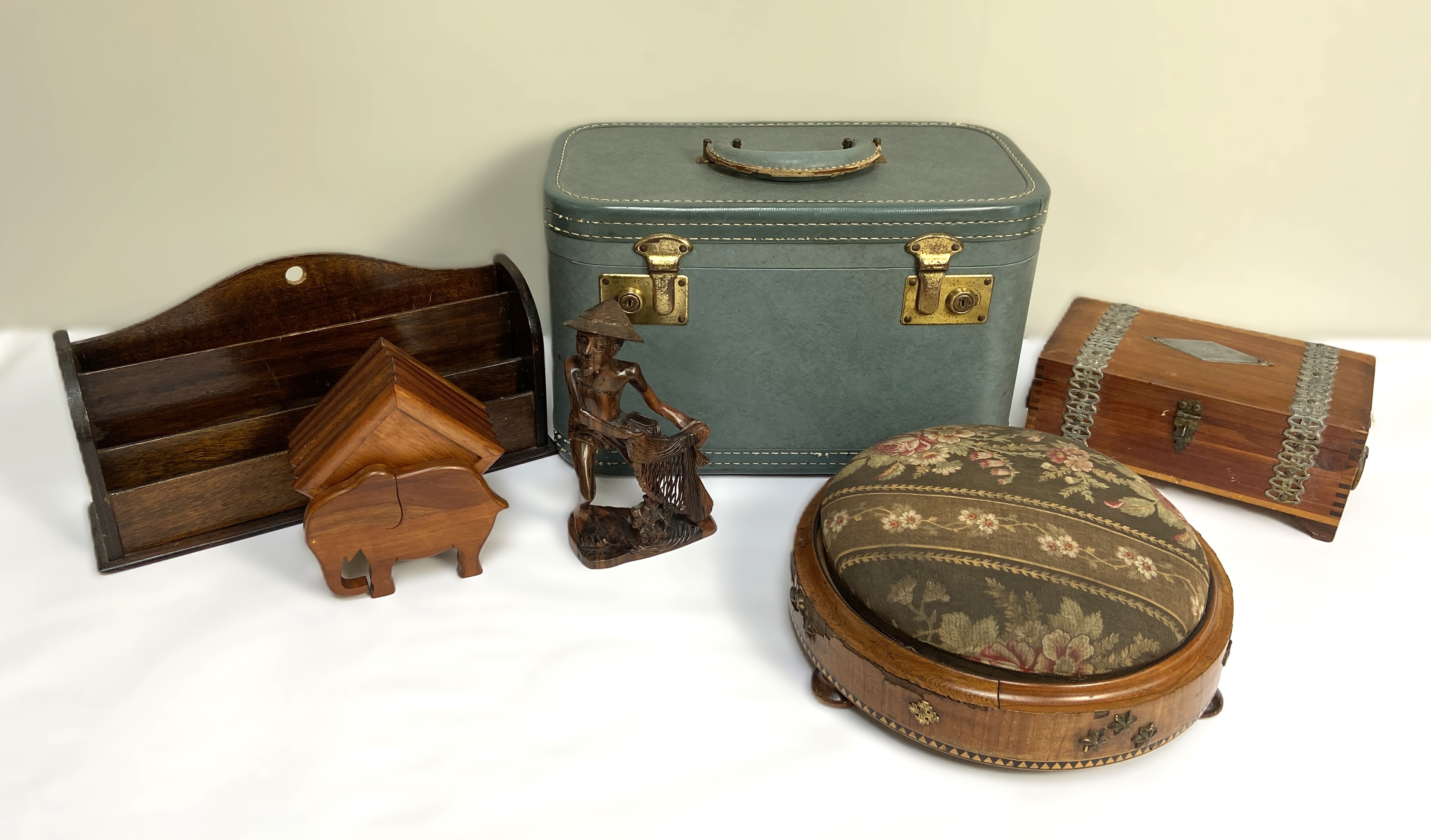 Assorted items, including an embroidered footstool, an travel vanity case, a carved figure,