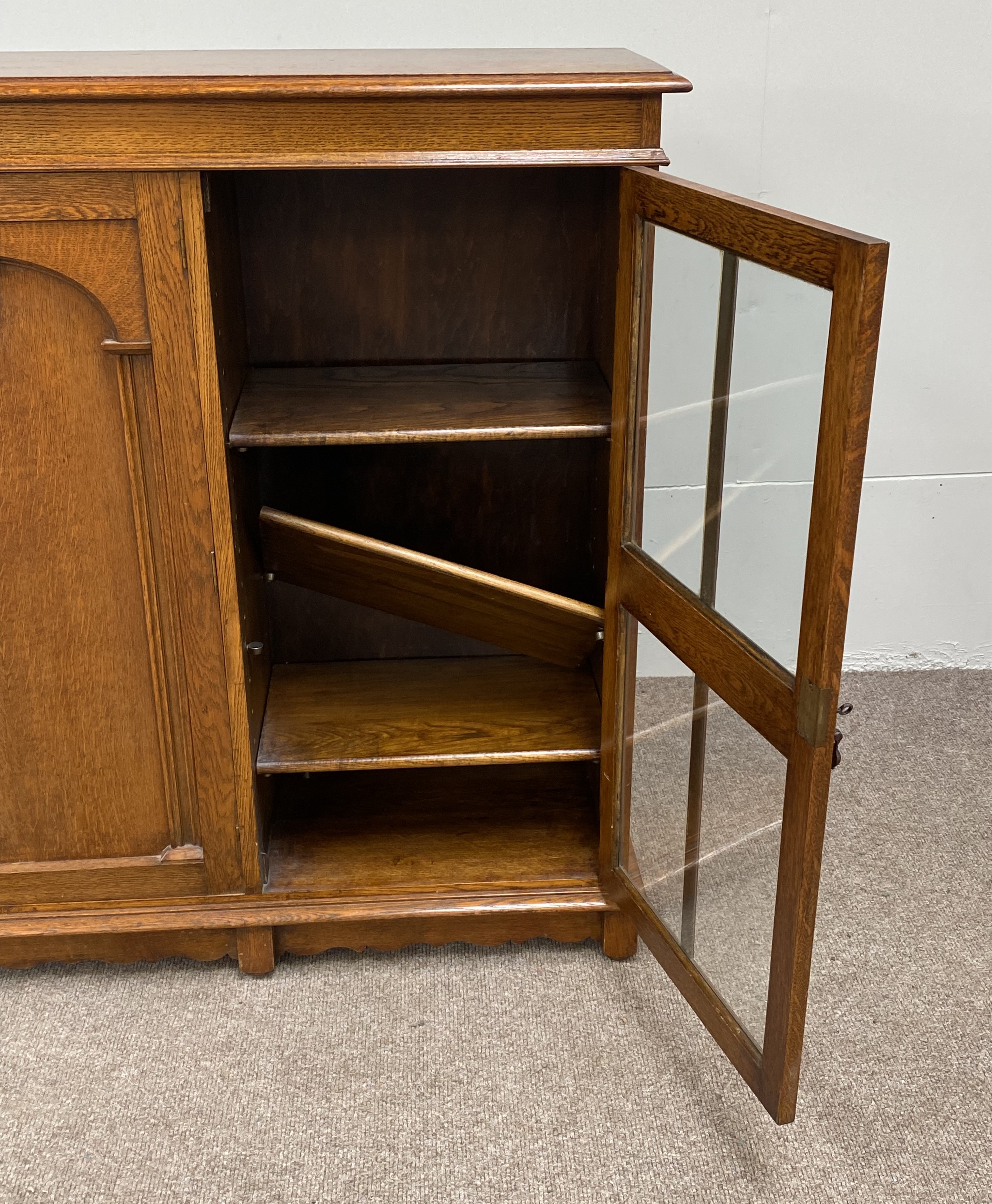 A vintage oak china cabinet, with a central arch moulded door and flanked by two glazed doors, - Image 6 of 8