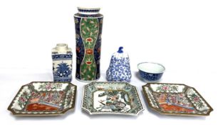 A selection of modern Chinese porcelain, including a blue and white rice bowl, inset with