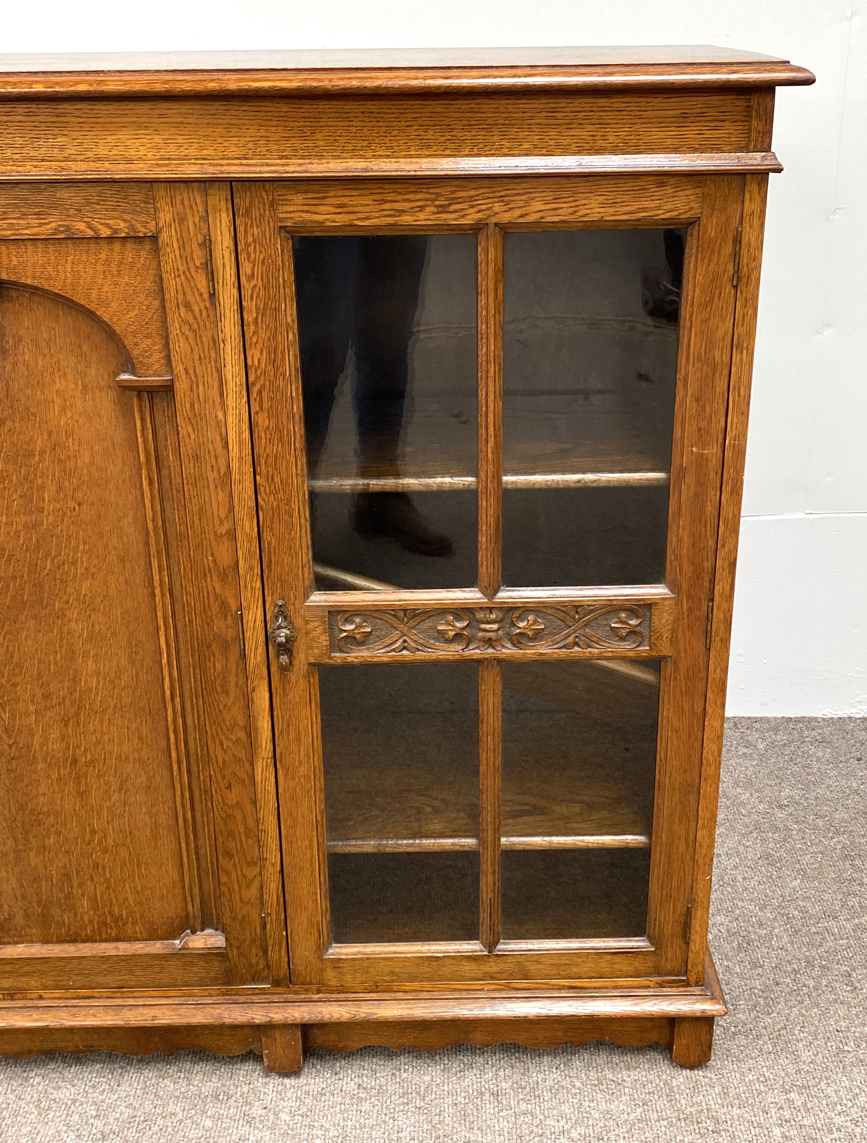 A vintage oak china cabinet, with a central arch moulded door and flanked by two glazed doors, - Image 3 of 8