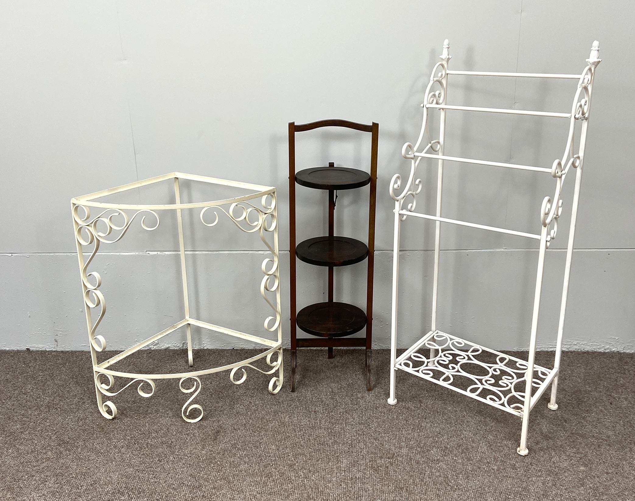 A vintage white painted wrought iron towel rail; a painted corner stand, a folding tray topped table