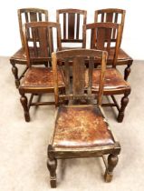 A set of six vintage dining chairs with leather drop in seats and turned front legs with stretchers;