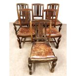 A set of six vintage dining chairs with leather drop in seats and turned front legs with stretchers;