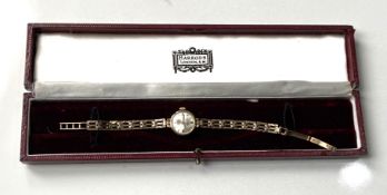 A Rotary 9 carat gold ladies dress watch, hallmarked gold linked strap, 21 jewel movement, 13mm