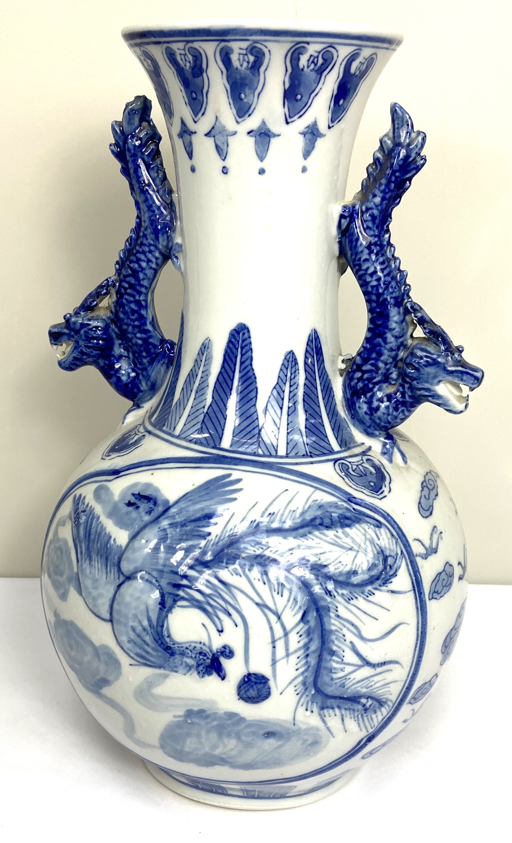 A Chinese blue and white vase and matching base, modern, decorated in underglaze glue with Dragons - Image 2 of 7