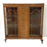 A vintage George III reproduction china display cabinet, with burr walnut veneered central door,