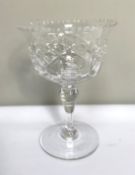 A large selection of clear crystal table glassware, including various sets of wine goblets, brandy