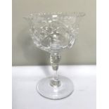 A large selection of clear crystal table glassware, including various sets of wine goblets, brandy