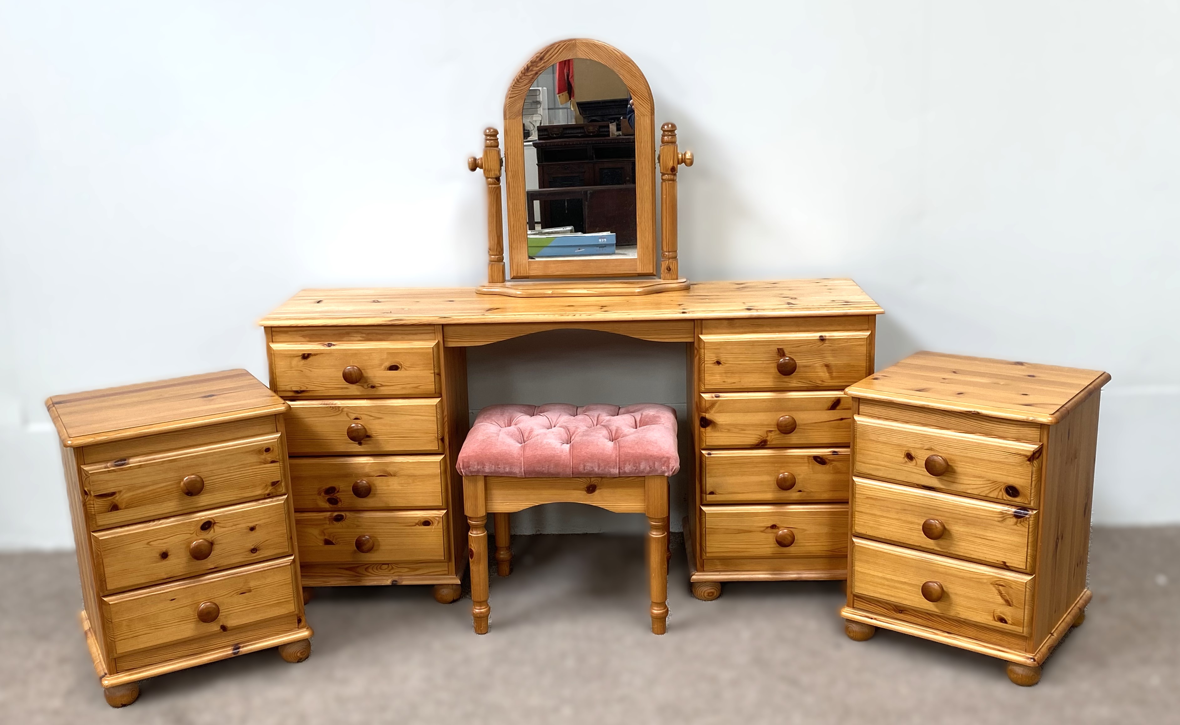 A pine bedroom suite, comprising a dressing table, mirror, stool and two bedside tables (5)