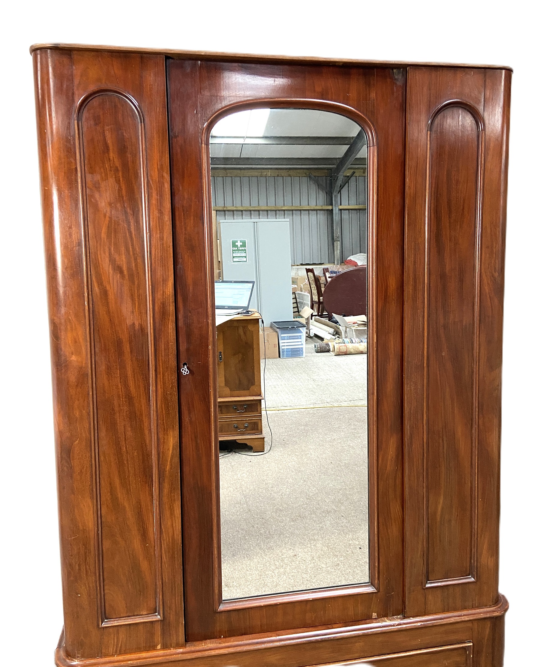 A Victorian mahogany single warbrobe, with mirrored arched door over a long drawer. (lacks - Image 2 of 6