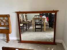 A vintage mahogany overmantel mirror, 20th century, with a bevelled rectangular plate and fluted